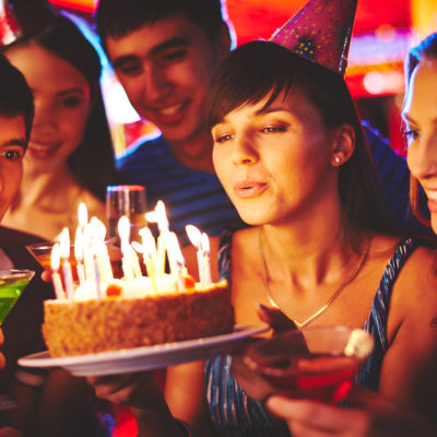 group of young people celebrating a teen birthday party