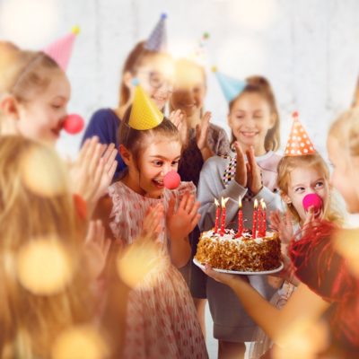 Kids with Cake at child's birthday party