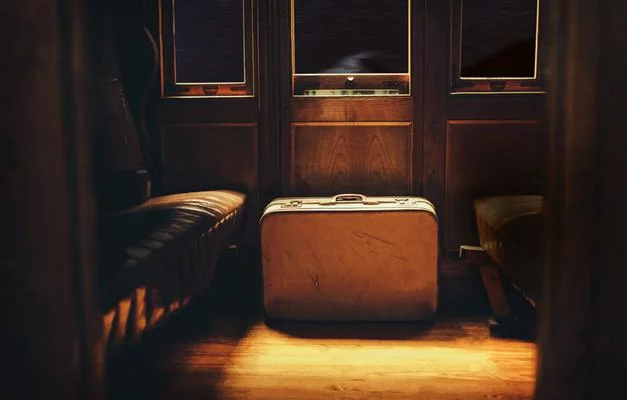 suitcase on the floor of a train cabin
